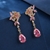 Picture of Low Cost Gold Plated Pink Dangle Earrings with Low Cost